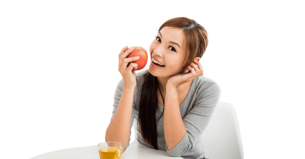 A person eating apples for weight loss.