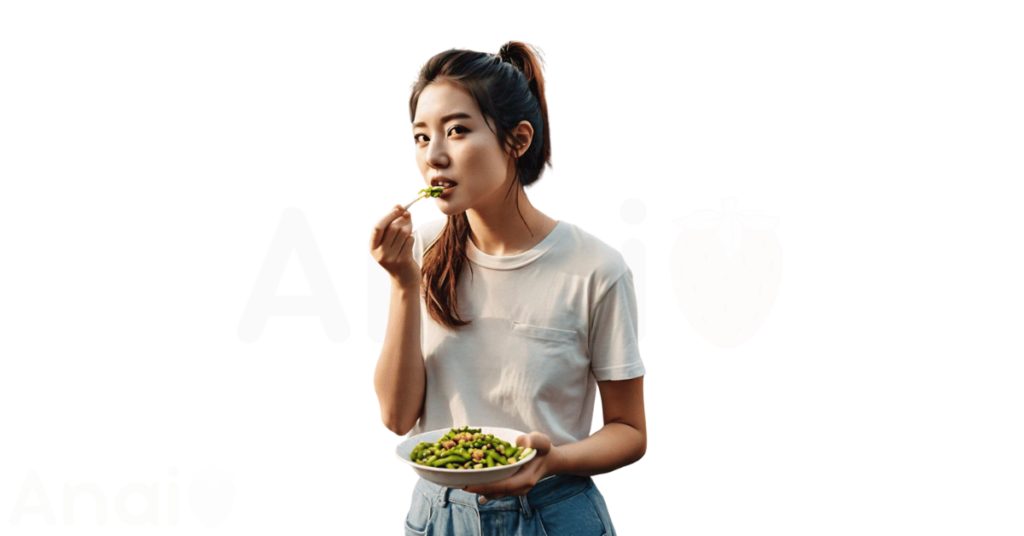 A person eating edamame for weight loss.