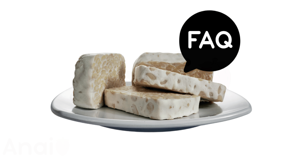 A pic of fresh tempeh next to a black banner for tempeh nutrition FAQs.